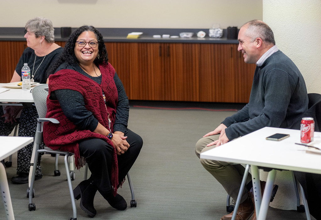 Diverse team working on AI project in modern office