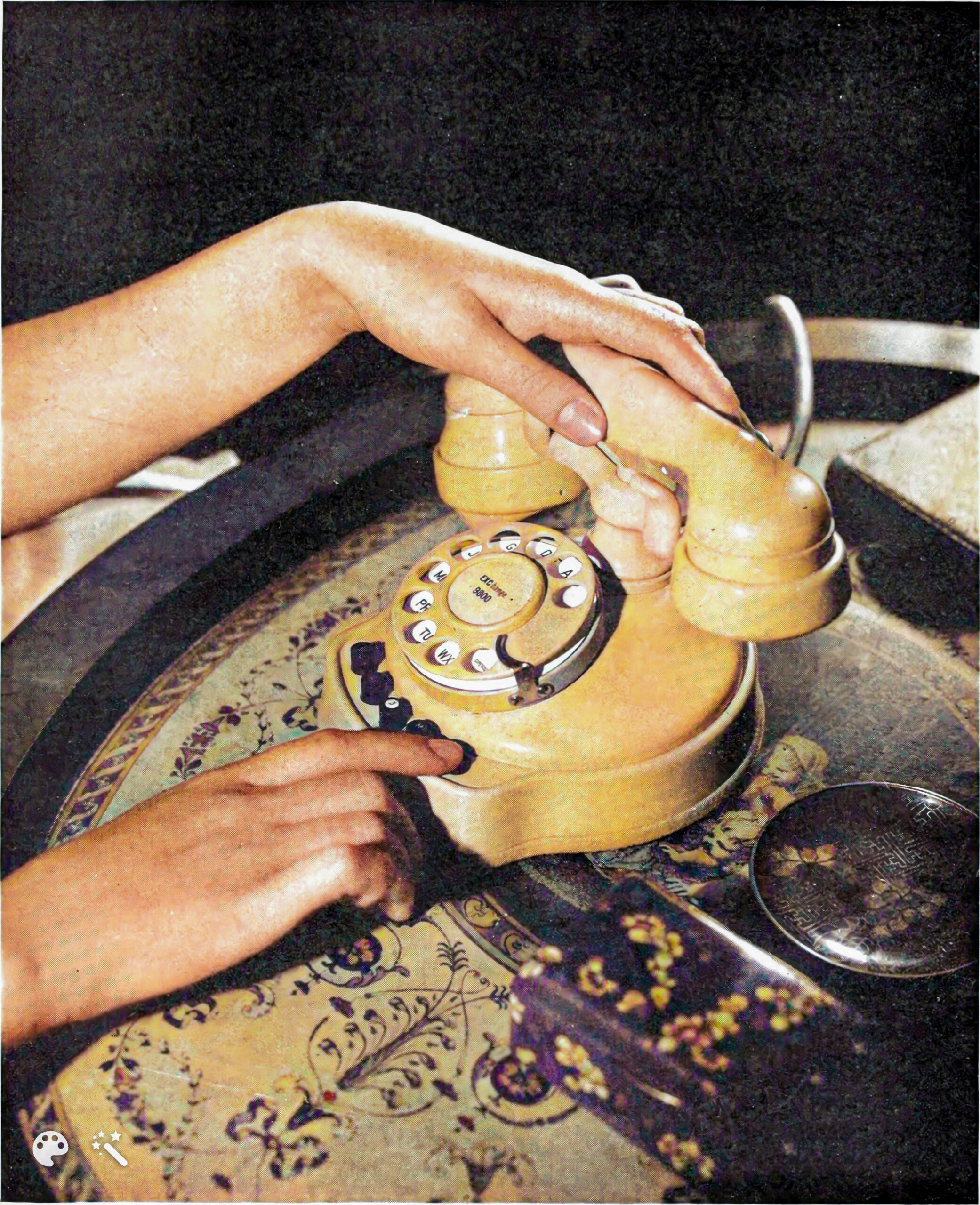Home office desk with laptop, printed books, coffee mug, and notepad
